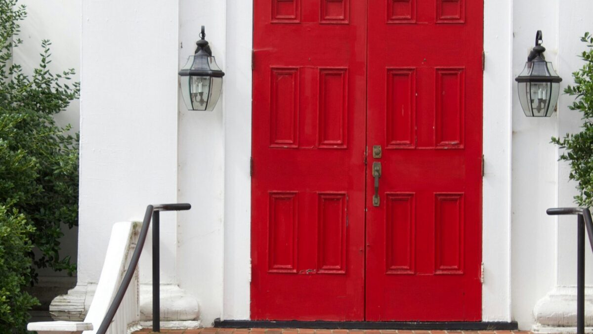 Red front doors of a church building